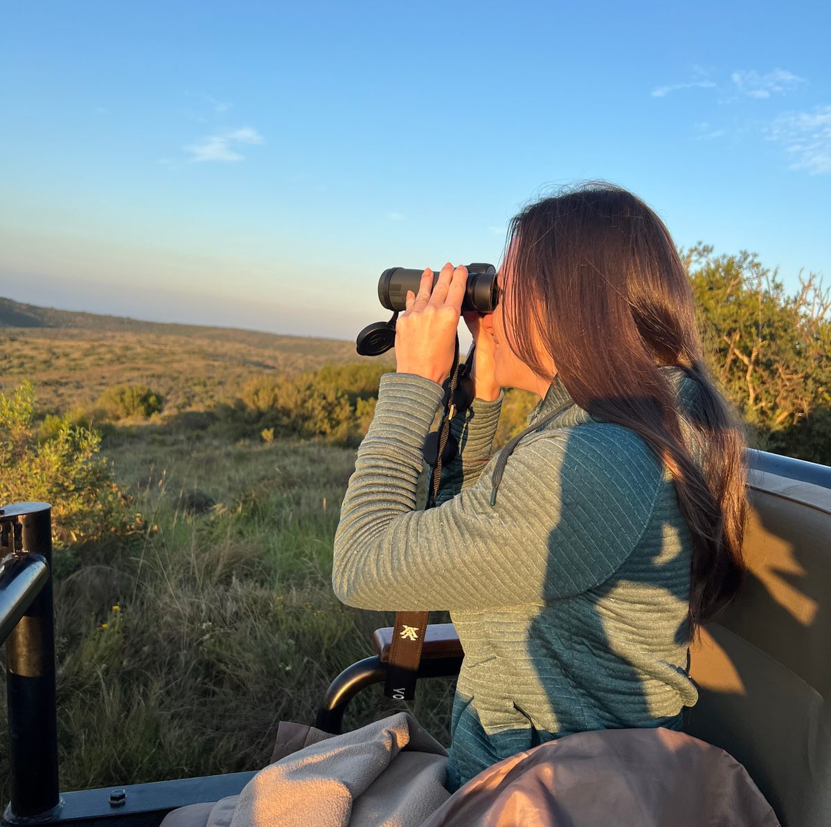 woman and binoculars