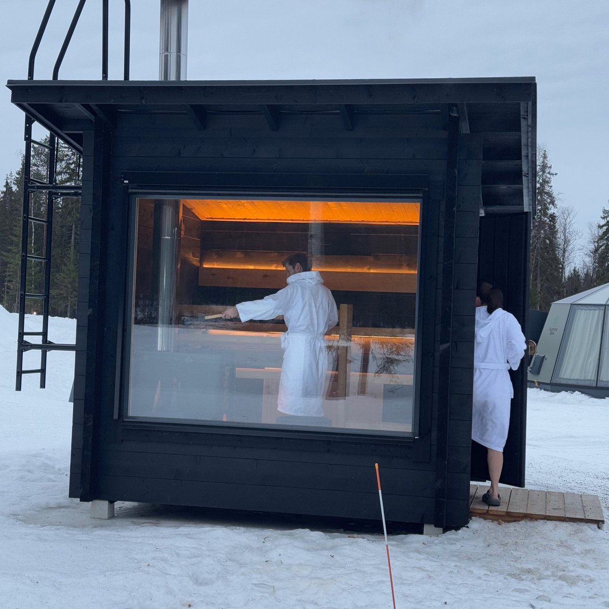 man and woman in sauna