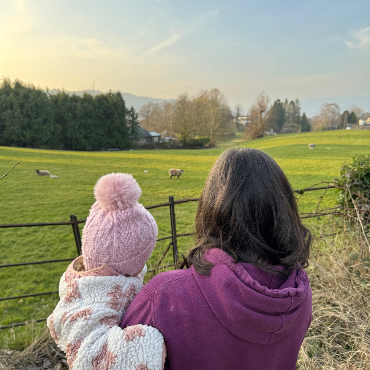 woman and baby and field