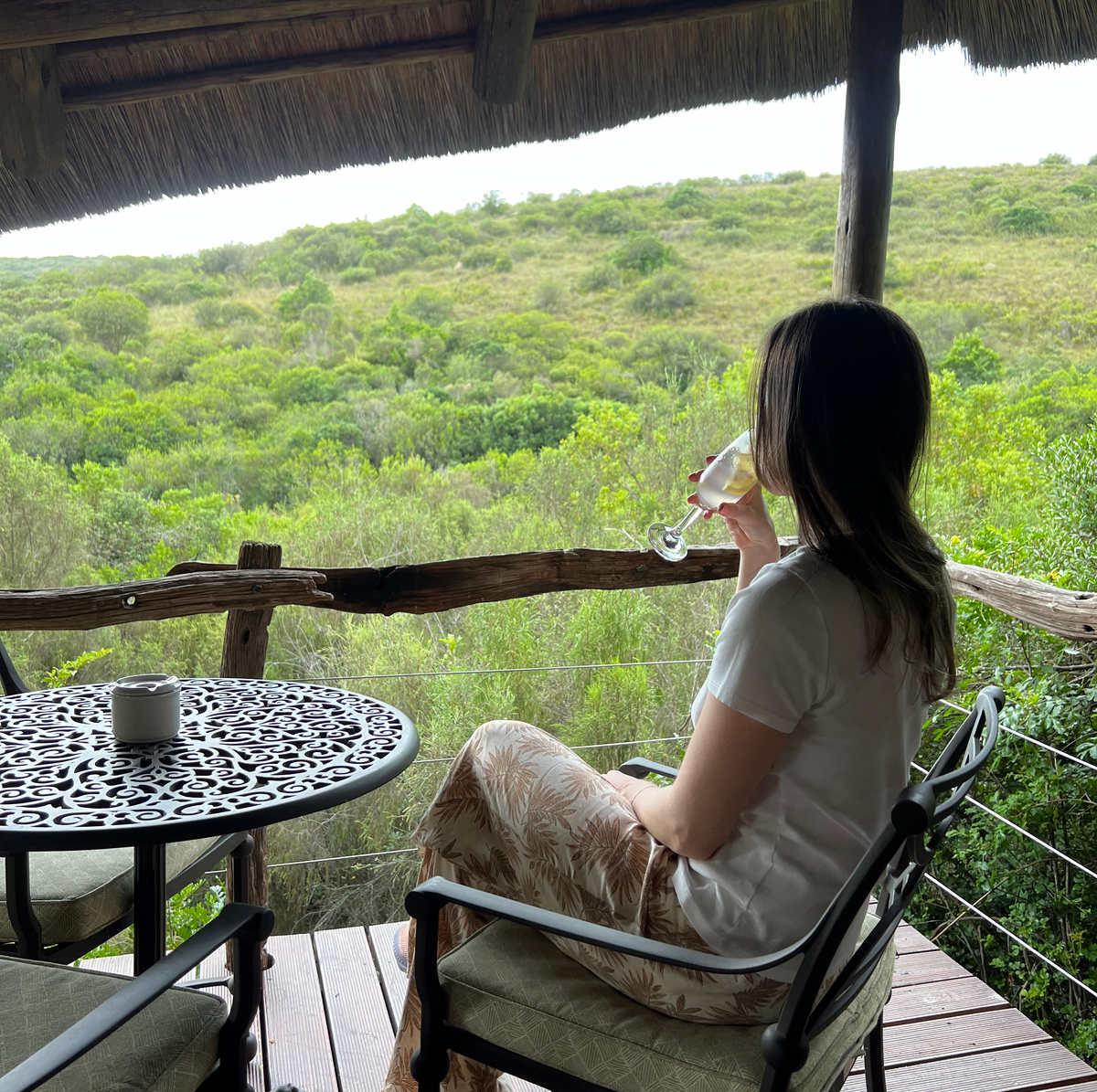 Woman drinking on balcony