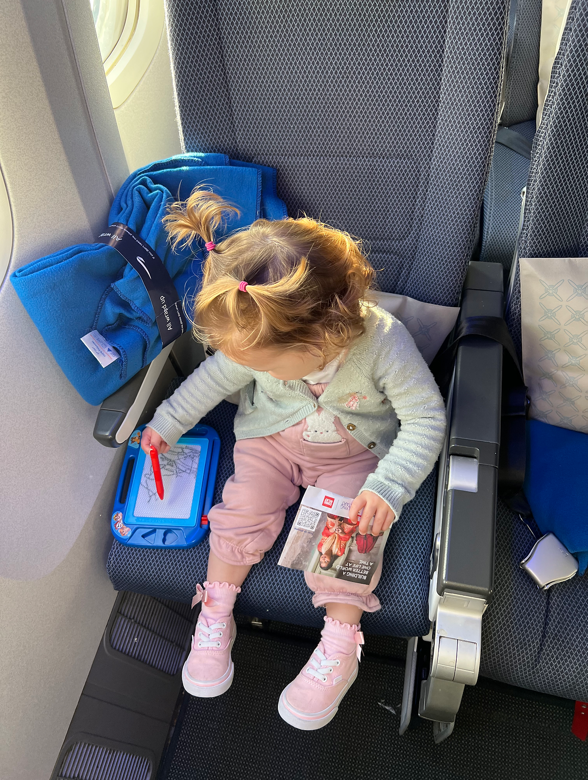 TIPS FOR FLYING LONG HAUL WITH A TODDLER Baby on aeroplane
