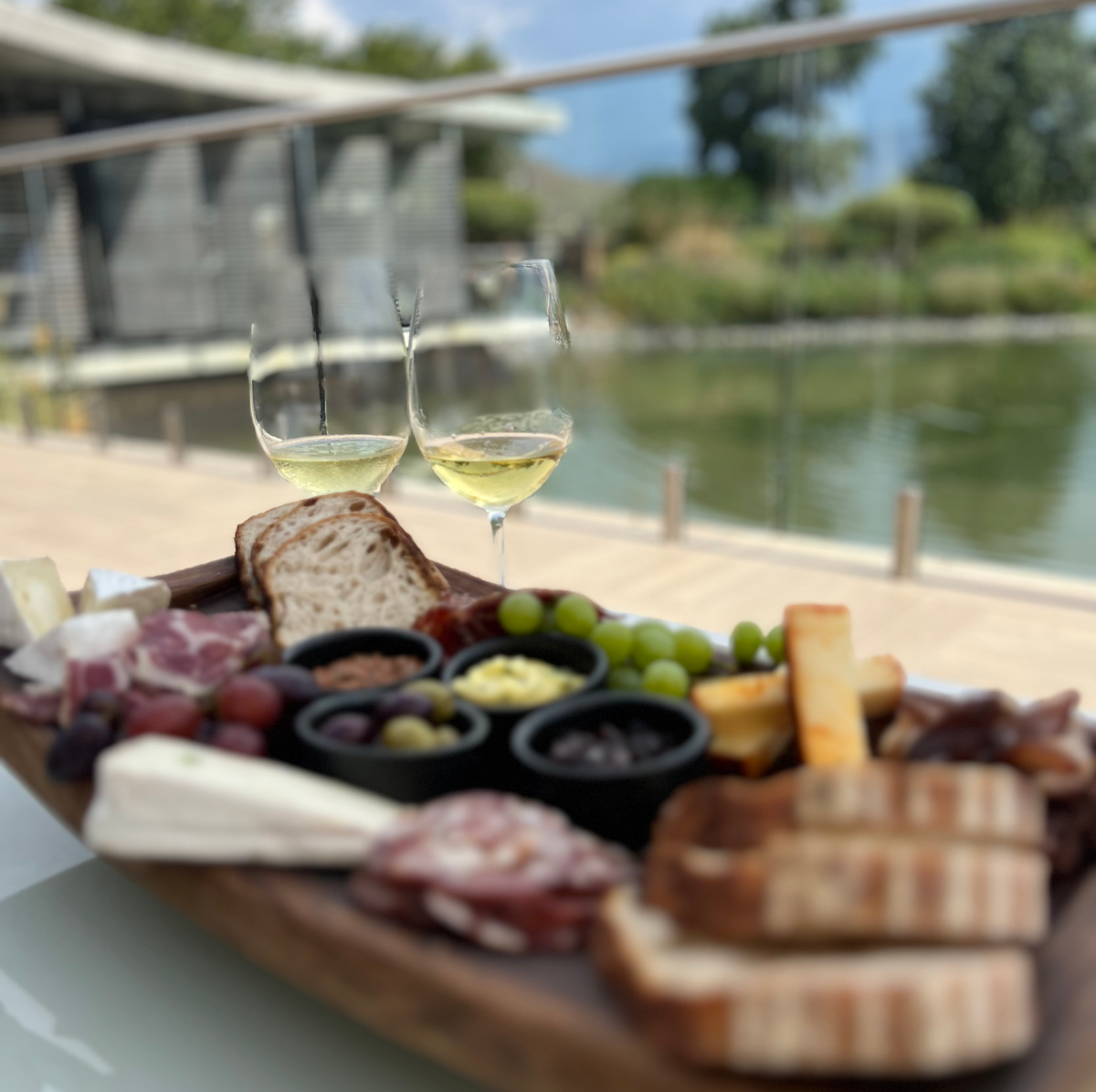 WHAT YOU NEED TO KNOW ABOUT THE FRANSCHHOEK WINE TRAM Charcuterie platter and wine